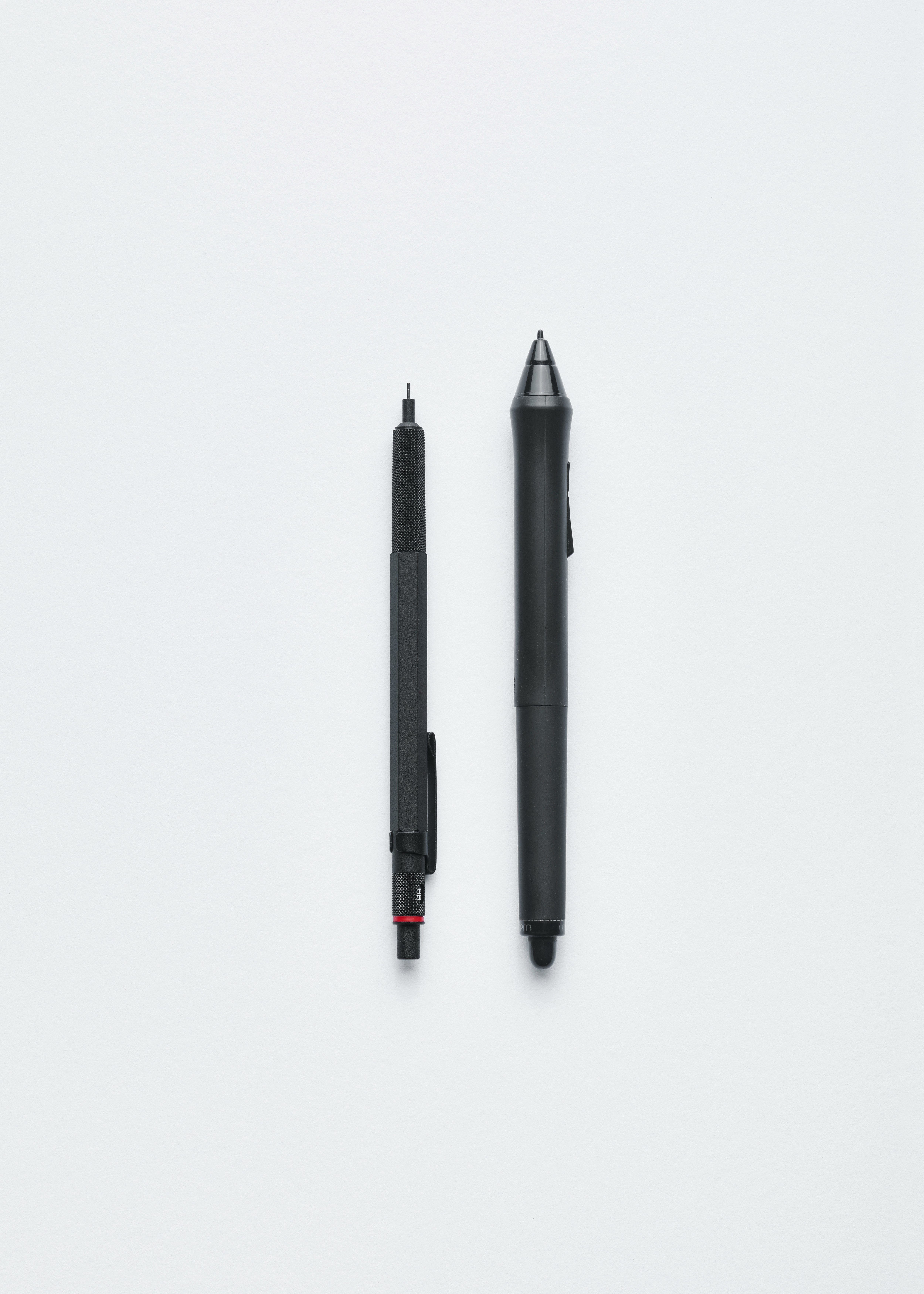 A mechanical pencil and a pen.